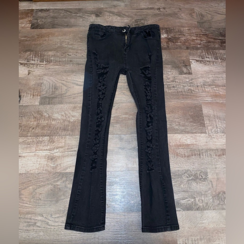 Distressed black skinny jeans
